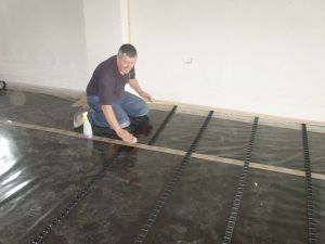 Cleaning the surface of the vapour barrier to ensure a positive adhesion of the clip rails. This type of fixing minimises the use of the staple type pipe retainers, as repeatedly puncturing the vapour barrier and insulation can result in subsequent failure and non-compliance with building regulations.